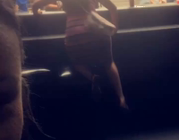 girl falls while trying to climb on top of chair
