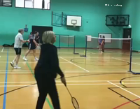 Older woman badminton hit fail