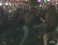 Girl green jacket drags girl black hair