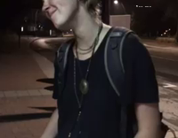 drunk man in black naps on street