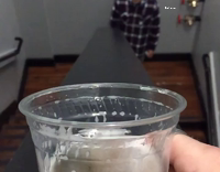 guy sliding drink down the stairs and friend catching it