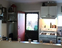 dog staring at owner from above stairs 