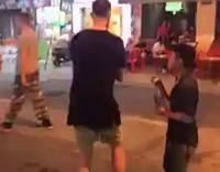 guy blowing fire ends up burning himself