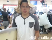 Guy surfs down escalator