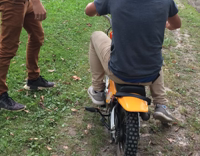 Blue Shirt Guy Falls Off Tiny Yellow Motorbike