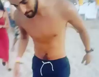 Man In Blue Swim Trucks Tries To Do Backflip on Sand But Underrotates and Lands On Head