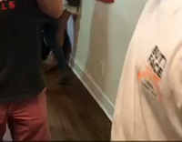 man uses cast to open beer