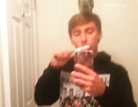 squirrels on top of guy while brushing his teeth then jumps towards mirror
