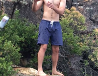 Guy Jumps Off Rock Into Water and Catches Beer