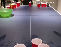 ping pong ball hits camera and makes it in the cup