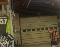 Guy second floor jumps onto two white tables