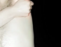 Guy lights cigarette with armpit fire