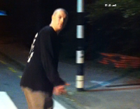 Guy runs at red and blue government official signs