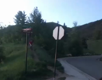 Guy Thows Football At Mountain Biker and He Falls Into Street
