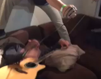 Sleeping Guy With Strings on Wrists Puppet Guitar Player