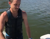 Impressive Wake Board Surfer Drinks a Beer and Does Tricks Behind Boat