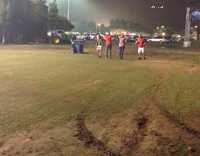 Two guys racing grass face plant