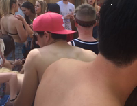 Shirtless backwards pink hat pool dive