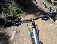 guy mountain biking and falls down