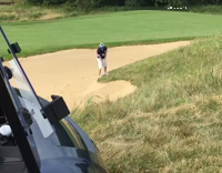 guy playing golf falls  as he swings
