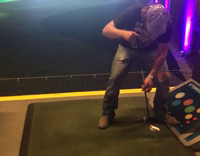 Guy golf between legs backwards