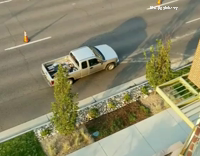 man sleeping in bed of truck