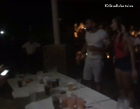 Shirtless Man Slides Across Table Full of Beers