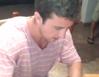 Guy at Table Eats a Candle