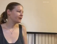 Woman Trains Black and White Dog To Whisper In Her Ear