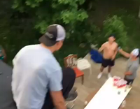 Black and White Hat Jumps From Roof Onto Table Full of Cups and They go Flying Into Air