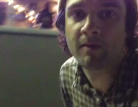 Yellow Beenie Guy Skateboards Down Alley and Films Two People Having Oral Sex